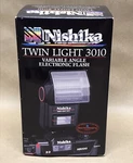 Nishika Twin Light 3010 Variable Angle Shoe Mount Flash (for Use W/N8000 Camera). Fixed Price $80.00.