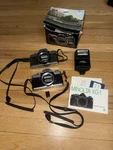 Minolta XG-1 35MM Film Camera Bodies + Auto 200X Flash Manuals As-is. Fixed Price $130.00.