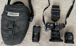 Minolta Maxxum 7000 Camera Bundle, 3 Lenses, Flash, Case & Manuals. Fixed Price $175.00.