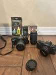 Canon T50 Cameras, 3 Lenses, Case, Flash. Fixed Price $100.00.