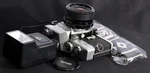 Minolta Sr-t 101 Chrome 35MM Film Slr C/w Tefnon 28MM F/2.8 Wide Lens &flash Kit. Fixed Price $459.99.