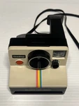 Vintage Polaroid Onestep Land Camera SX-70 Rainbow Stripe Instant Film. Fixed Price $34.95.