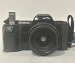 Olympus OM77AF Film Camera W/ 35-70MM Zoom Lens Tested & Working. Fixed Price $34.99.