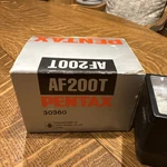 Pentax AF200T Shoe Mount Flash. Manufactured By Asahi Optical Co. Ltd. In Japan. Fixed Price $20.00.