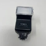 Minolta Auto 220X Universal Shoe Mount Camera Flash With Plastic Cover. Fixed Price $19.99.