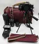 Canon T-70 Slr Camera W/3 Lenses, Albinar Flash, Tripod, Bag Parts/repair. Fixed Price $89.99.