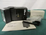 Black ST45 Electronic Flash With Wide & Tele Adapters + Manual (tested). Fixed Price $16.95.