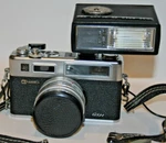 Yashica Electro 35 Gsn W/pro 50 Dx Flash Yashinon 45MM F/ 1..7 Lens. Fixed Price $165.00.