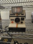 Vintage 1970'S Polaroid One Step Land Camera Rainbow Stripe 2351 Q-light Flash. Fixed Price $75.00.
