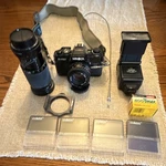 Minolta X-700 Mps Slr Film Camera W/ Md 50MM & Sigma 35-135MM Lens, Flash. Fixed Price $99.00.