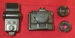 Nikon Em Body + Motor Drive 50MM F1.8 Series Lens Rokinon 28MM F2.8 Flash Lot. Fixed Price $99.99.