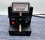 Polaroid Time-zero One Step Rainbow Land Camera W/ Q-light 2351 Flash. Fixed Price $29.99.