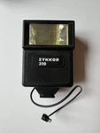 Zykkor 310 Electronic Flash / Bounce Quick - Vintage New Box. Fixed Price $12.00.