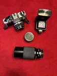 Olympus OM10 35MM Film Camera Vivitar 75-205MM Macro Focusing Zoom & Auto Flash. Fixed Price $150.00.