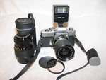 Minolta SRT201 35MM Slr Camera W/ 35-75MM Auto Zoom Lens & Flash. Fixed Price $115.00.