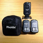 Phottix Ares Wireless Flash Trigger Set - 1 Transmitter & 2 Receivers W/ Case. Fixed Price $39.99.