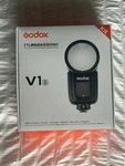 Godox V1-S Round Head Flash With Og Box, Accessories, & Profoto Soft Bounce. Fixed Price $450.00.
