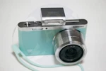 Samsung Mini Camera W/ Nx-m 9-27MM F3.5-5.6 Ed Ois Lens, All About Mint Green. Fixed Price $389.00.