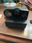 Polaroid Sonar One Step Camera With Model PR-50 And Book Case Untested. Fixed Price $17.95.