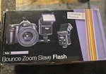 Vivitar SF-4000 Auto Bounce Zoom Slave Flash With Bracket. Fixed Price $16.00.