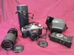 Canon AE-1 Program Slr Camera With Fd 50MM 1:18 & Vivitar 70-210MM Lenses. Fixed Price $175.00.
