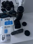 Minolta X-700 35MM Slr Film Camera With Starblitz 200DX Flash Lens 35-75MM. Fixed Price $175.00.