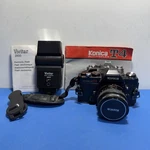 Konica Autoreflex T4 Film Camera + Hexanon 50MM F/1.7 Vivitar 2800 Flash. Read. Fixed Price $82.00.