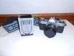 Canon AE-1 35MM Film Camera With 50MM F/1.8 Fd Lens W/strap & Elec. Flash. Fixed Price $200.50.